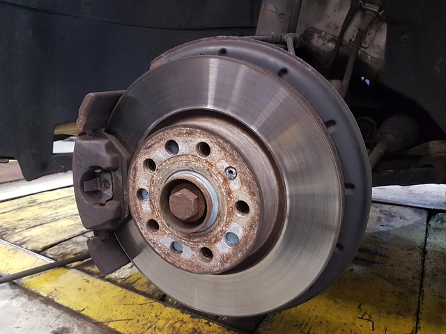 Close-up of a car wheel and brake assembly during service